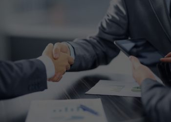 Business people shaking hands in office